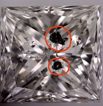 Princess cut diamond with black carbon inclusions before laser drilling